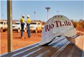 Rio Tinto profit misses on iron ore price slump, cuts dividend