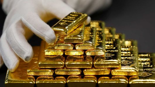 Gold rises, holds near 6-month highs on falling equities